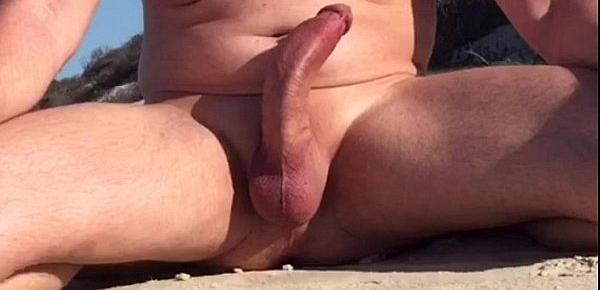  Rock hard curved cock at nude beach